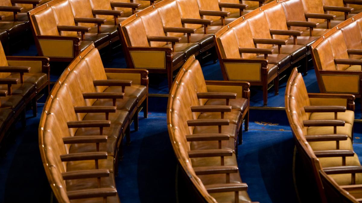 Photo of rows of empty chairs in Congress