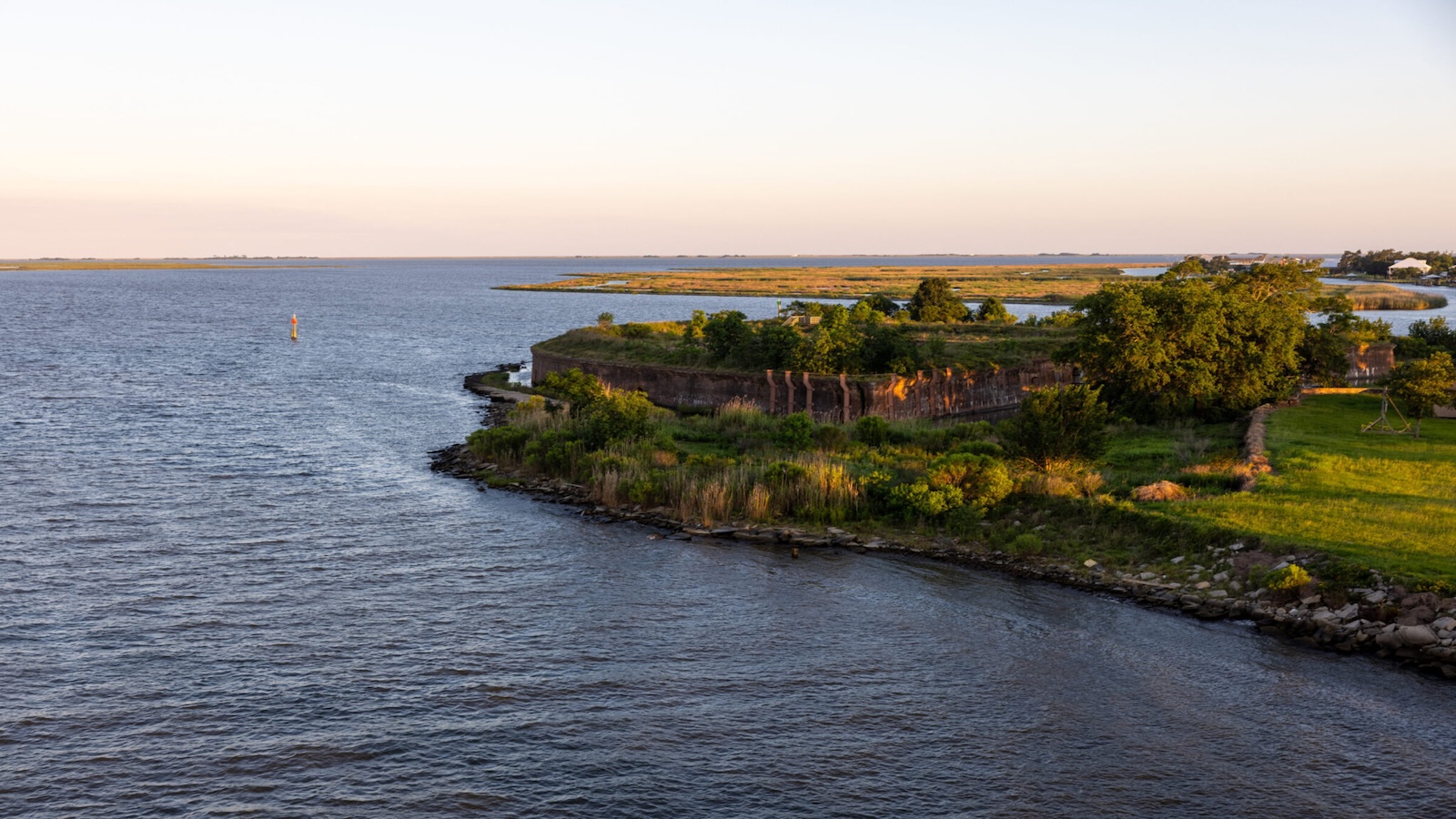 A strip of marshland surrounded by water