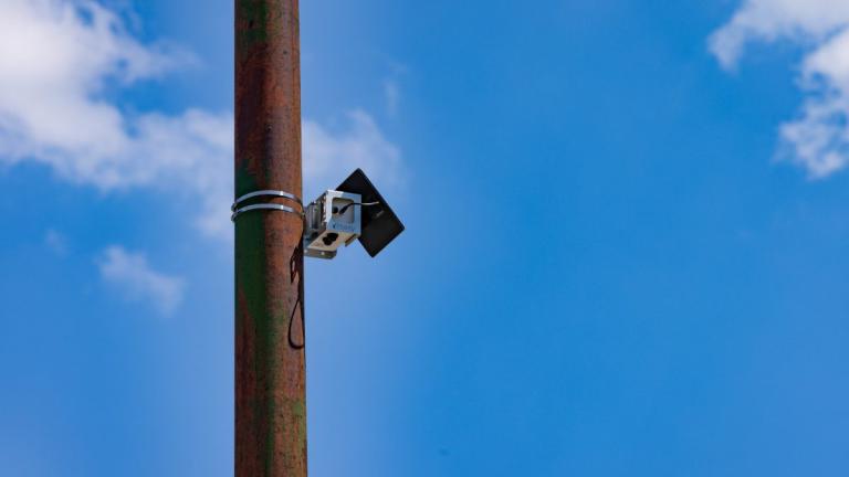 An air monitor attached to a light pole
