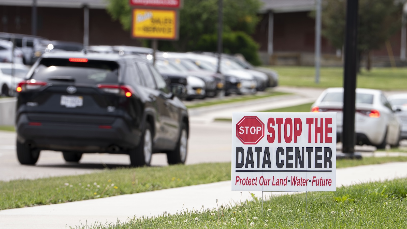 A home displays a “Stop the Date Center” sign along South 11th Street on Tuesday, May 19, 2026 in Nebraska City.