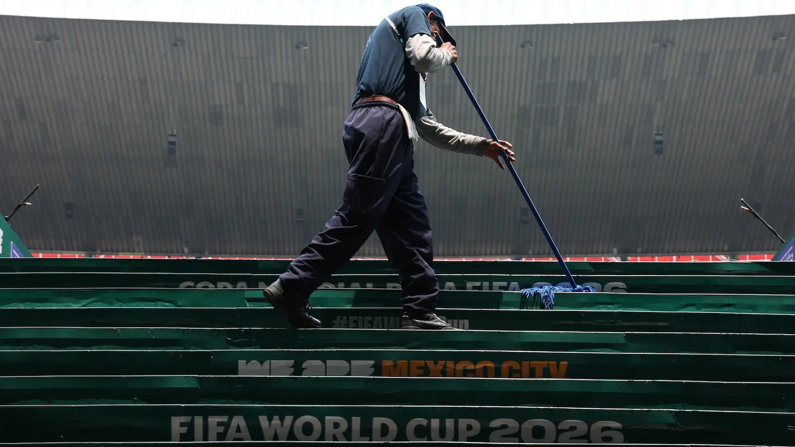 Stadium staff work before the FIFA World Cup 2026 Round of 16 match between Mexico and England at Mexico City Stadium
