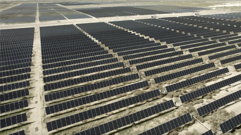 waves of solar panels spread into the distance in Utah