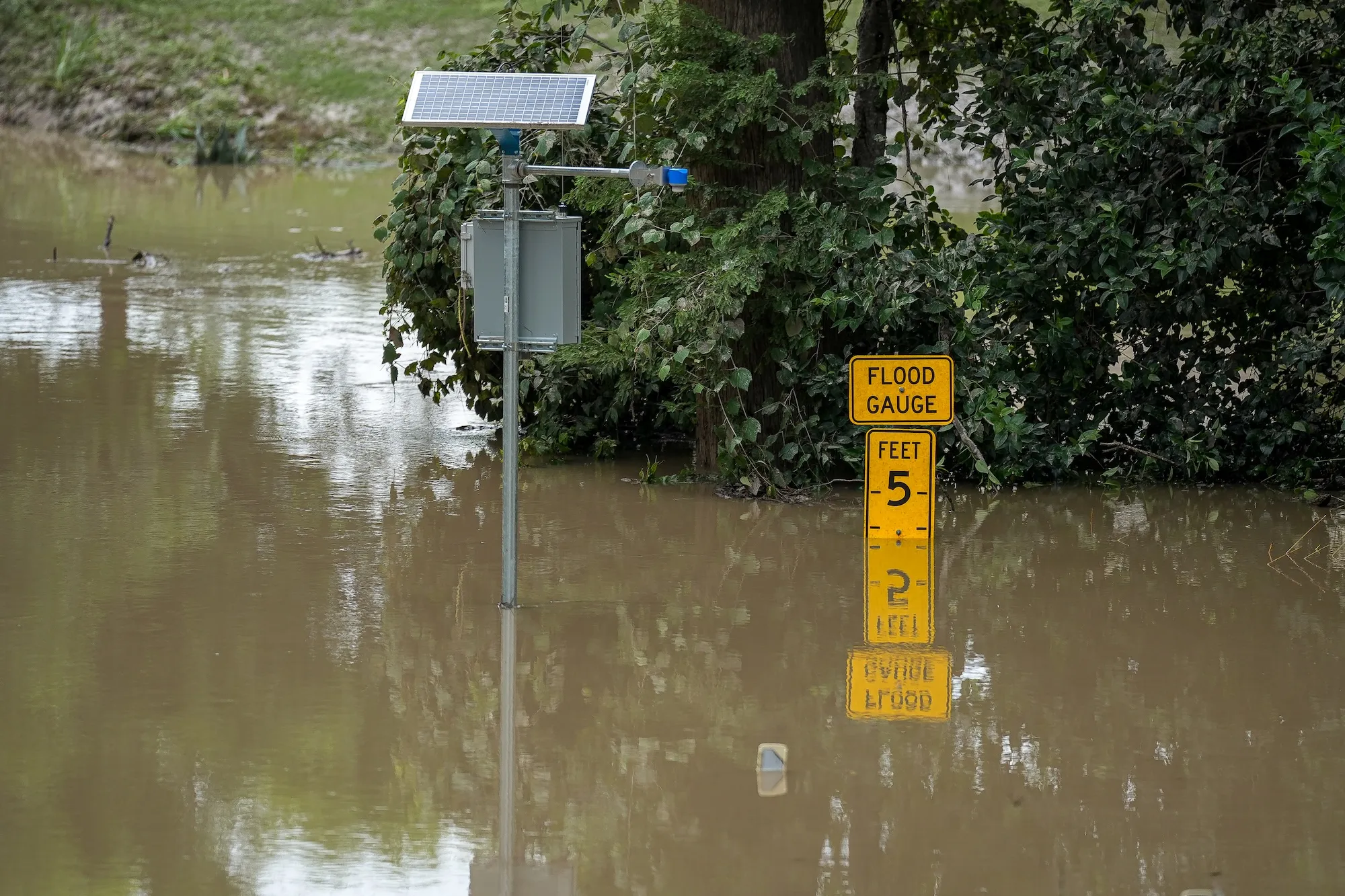 a flood gauge sign in water
