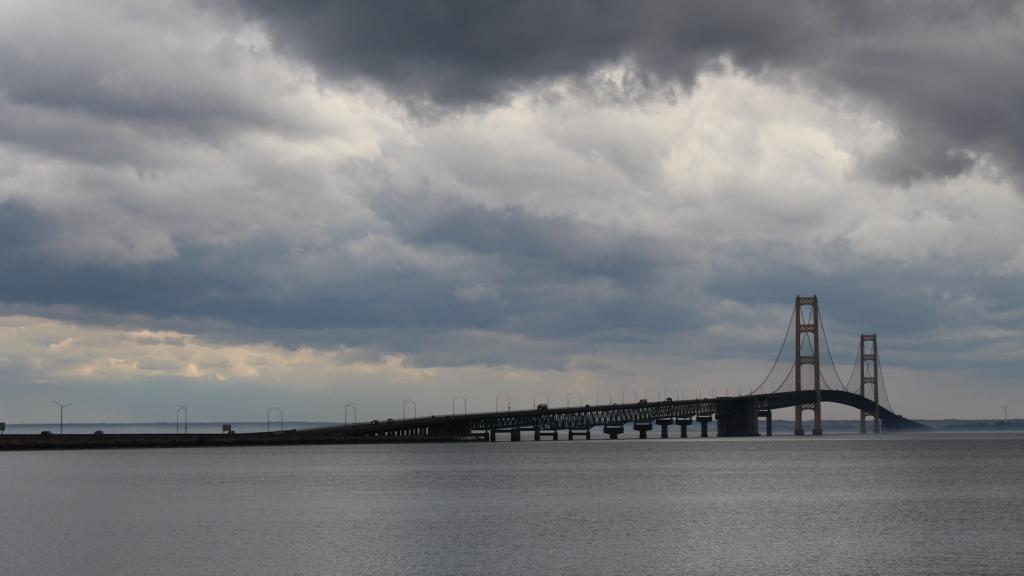 A wide view of the Mackinac Bridge on a stormy day.