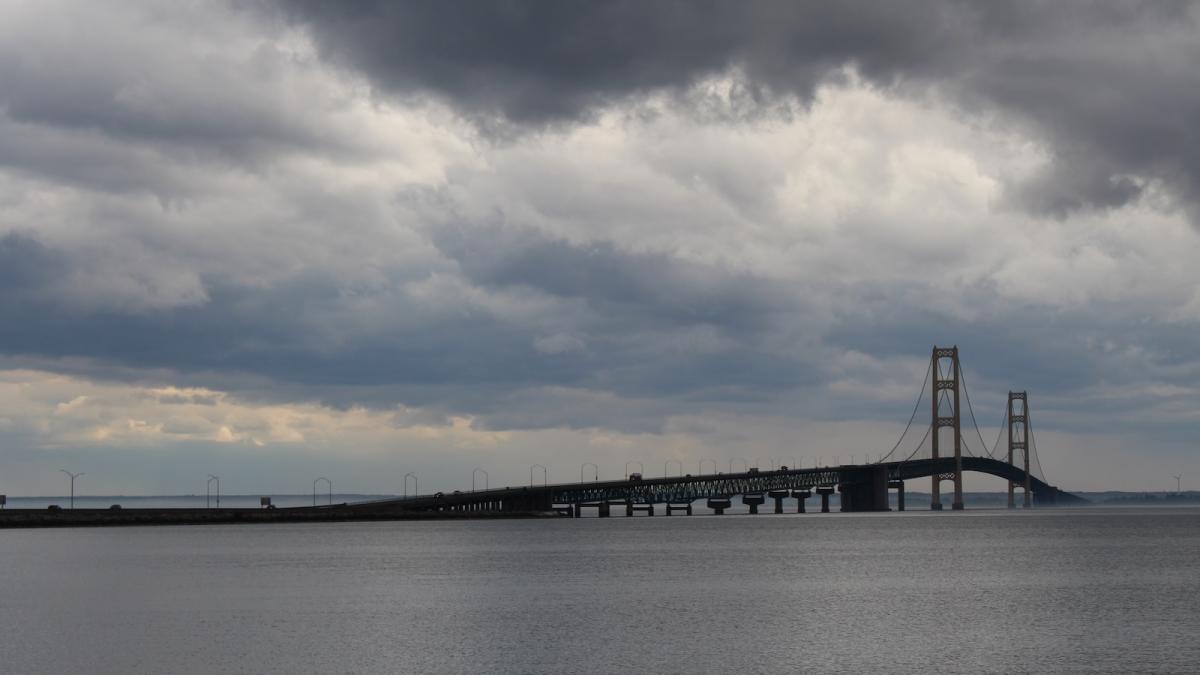 A wide view of the Mackinac Bridge on a stormy day.