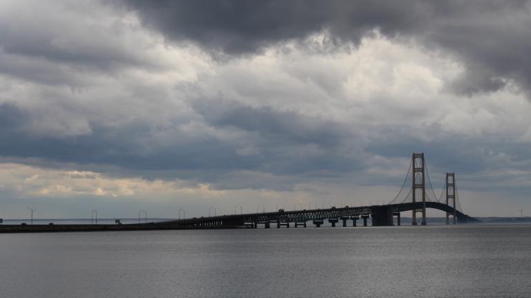 A wide view of the Mackinac Bridge on a stormy day.