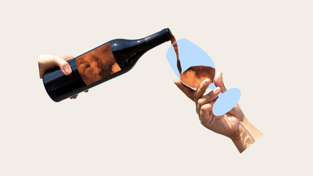 hand holding wine bottle pouring wildfire smoke into wine glass