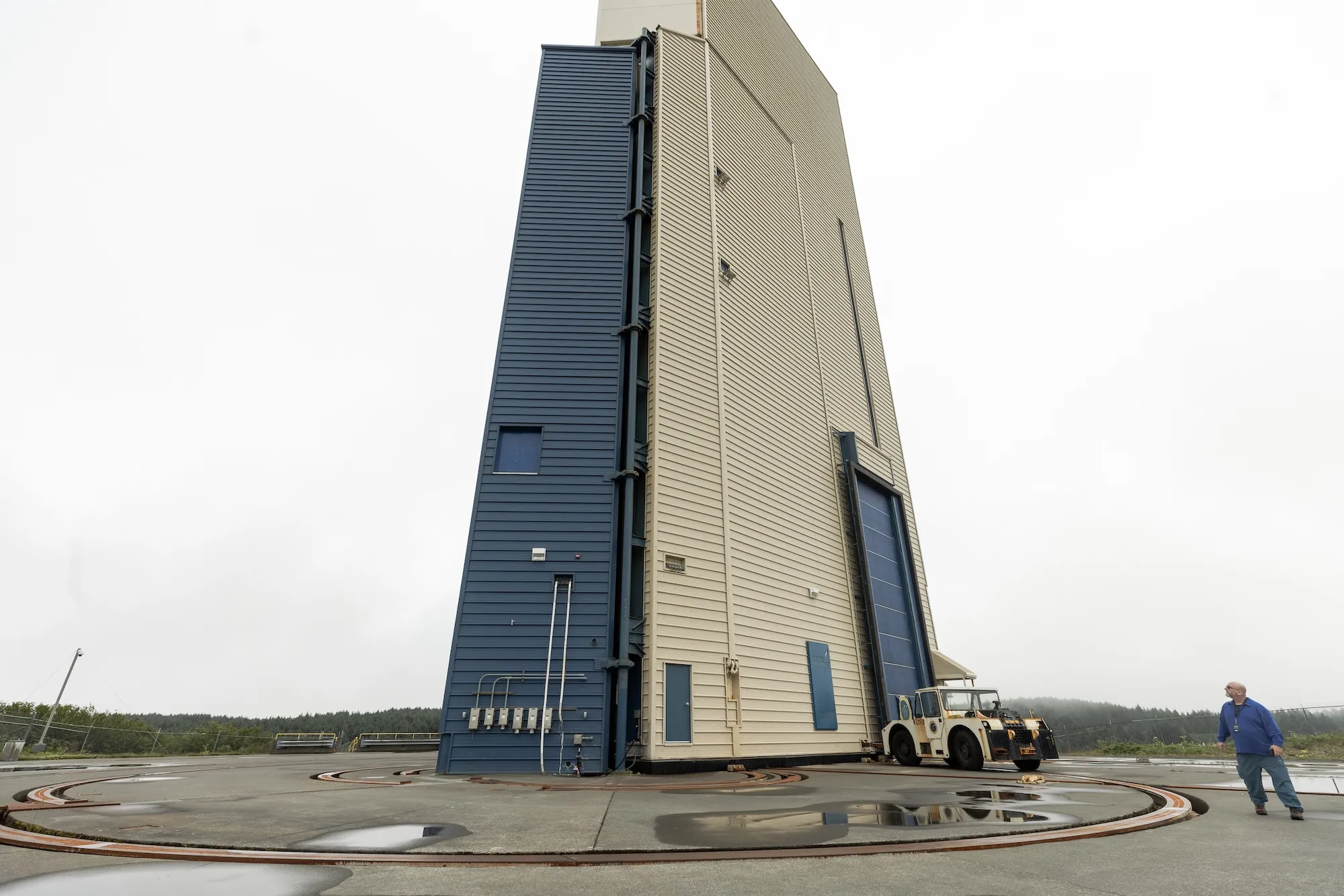 A tall building with a person working outside