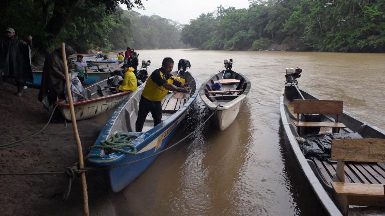Members of the Kichwa of Sarayaku people beach their boats on the banks of the Bobonaza river in Ecuador.