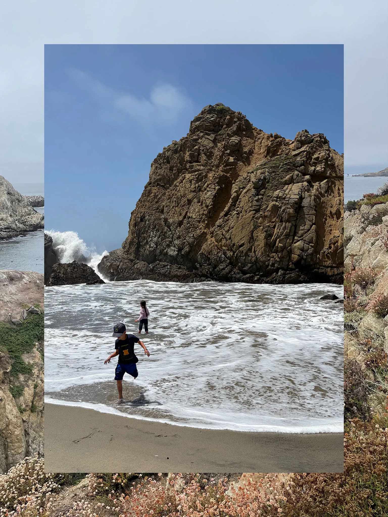 A collage consisting of two vertical photos, the outside functioning a border and the inside fully visible. The outside photo is a coastal trail and sea. The inner photo is two children playing in the surf near a rock formation with a spray of waves hitting in the corner.