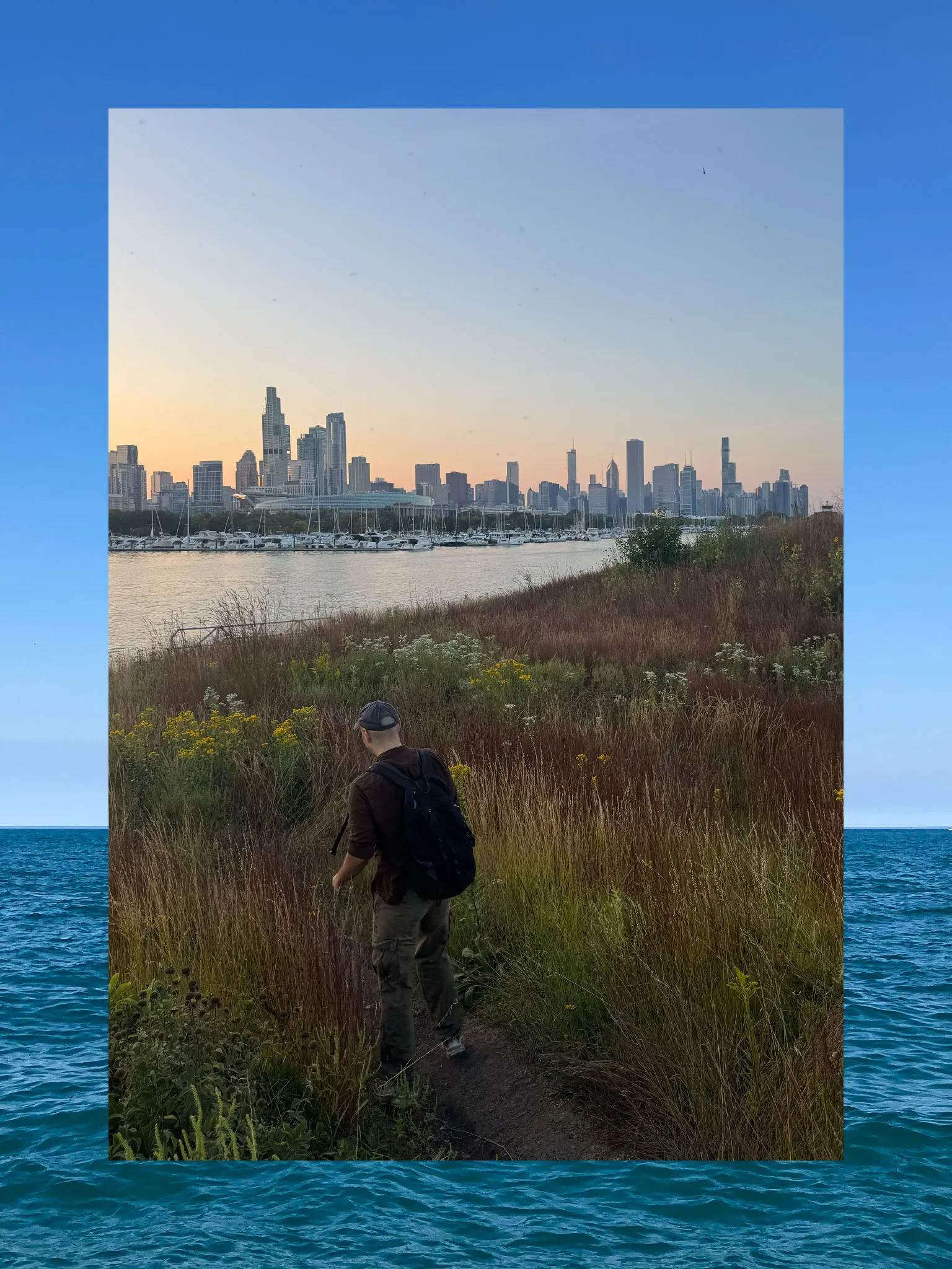 A collage consisting of two vertical photos, the outside functioning a border and the inside fully visible. The outside photo is a blue-turquoise lake and sky. The inner photo is a person walking a nature trail with the Chicago skyline in view.