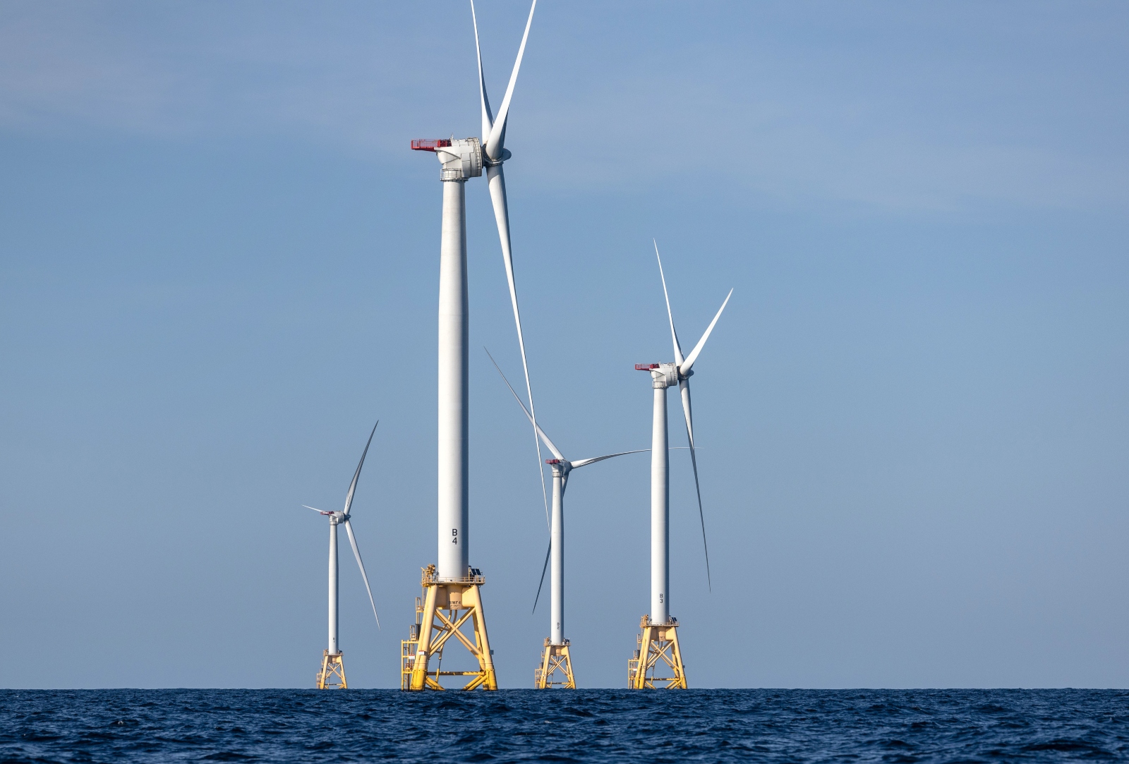 A group of wind turbines generate electricity at the Block Island Wind Farm off the coast of Rhode island. The clean energy industry has pushed for provisions that would prevent President Trump from cancelling future offshore wind permits.