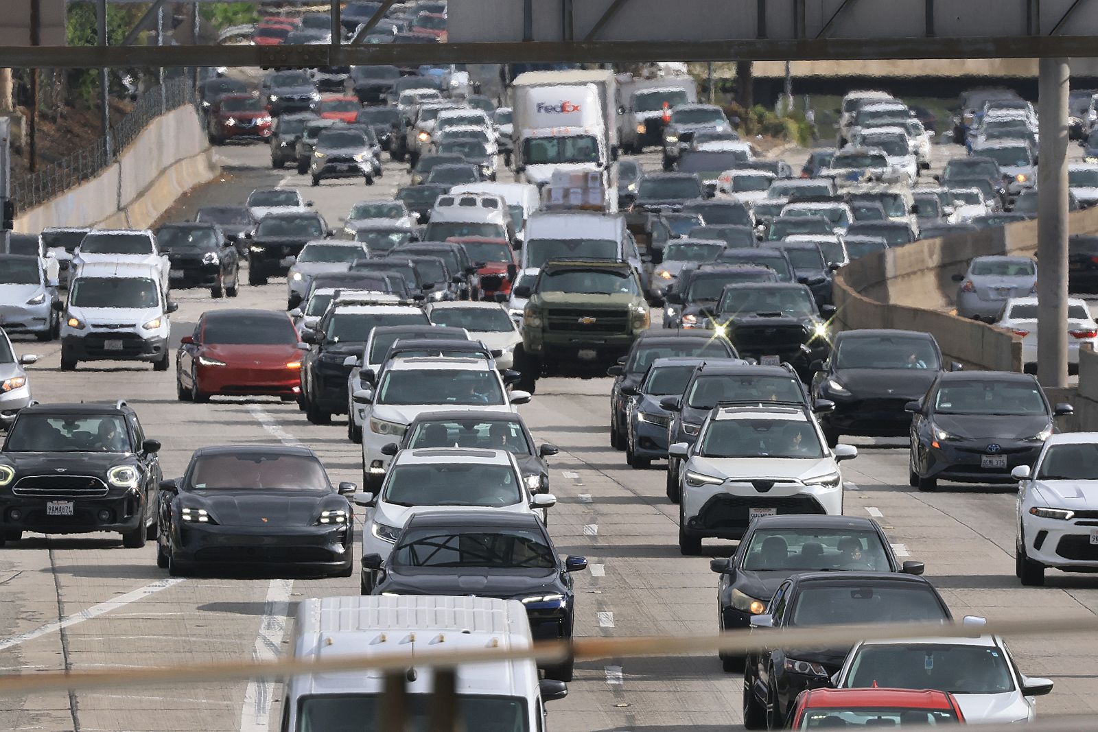 Cars stream down a highway