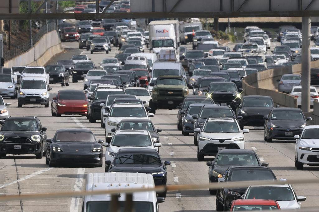 Cars stream down a highway