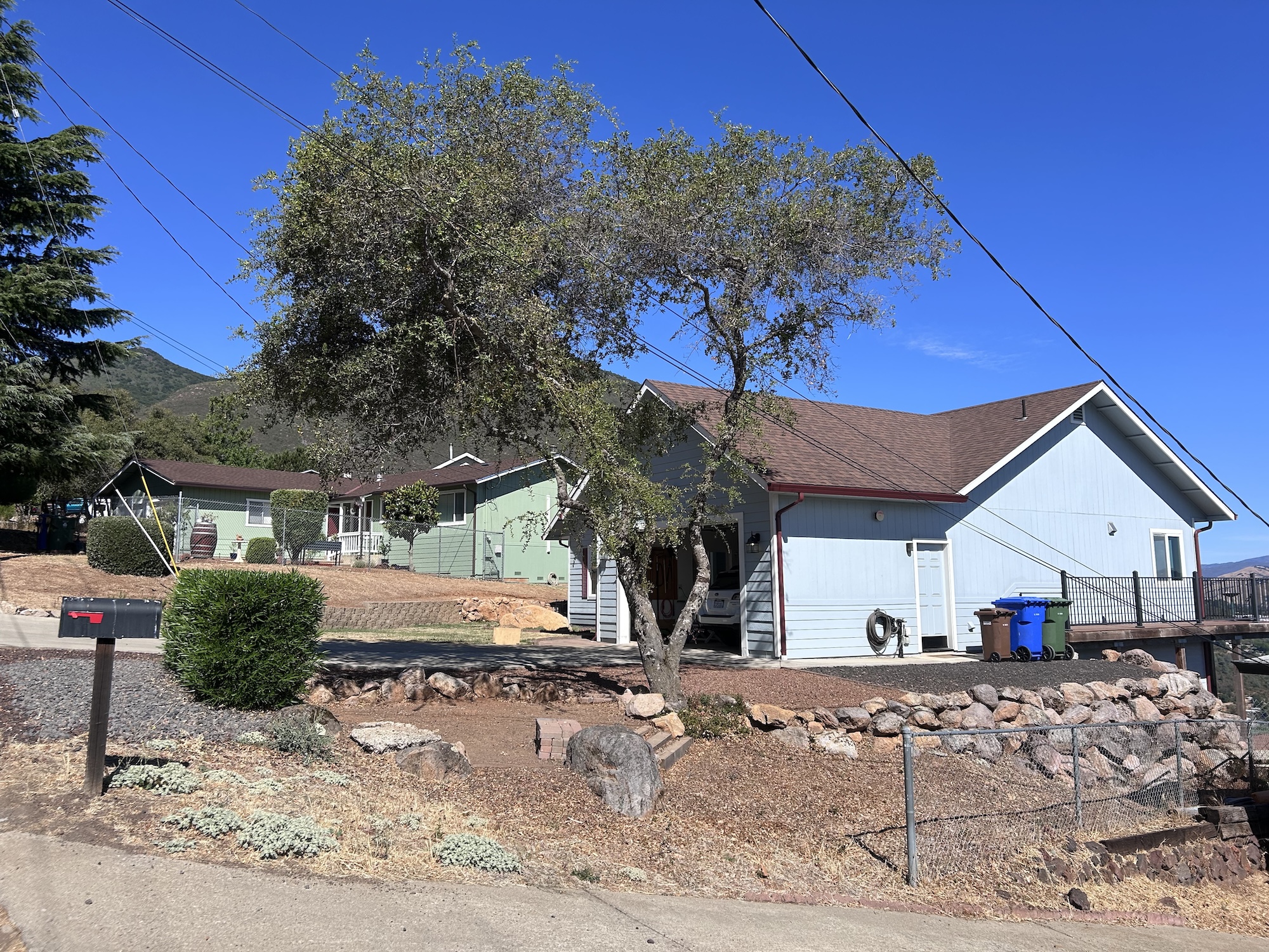 a blue house with fire-mitigated landscaping