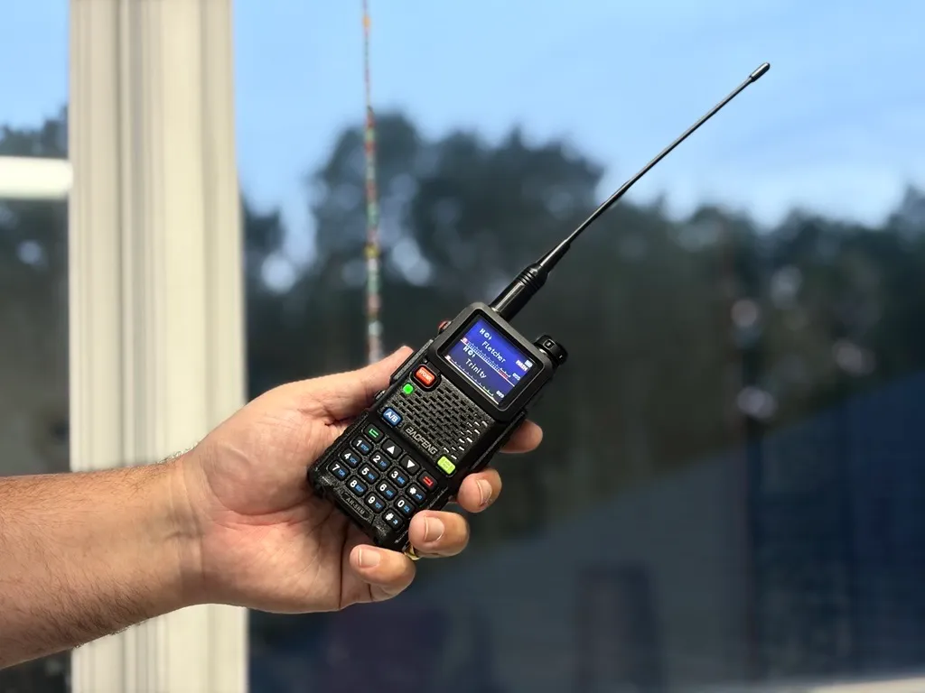 A man holds a radio