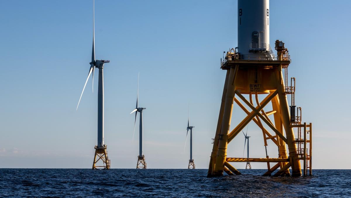 giant wind turbines in the blue water off the coast of Rhode Island