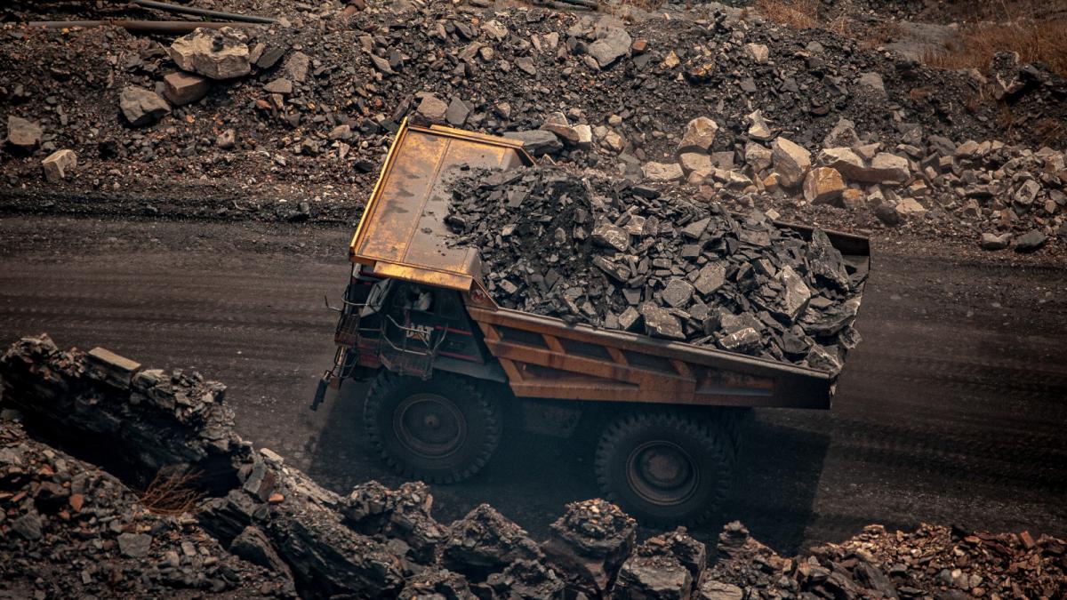 Photo of a truck hauling coal in a mining area