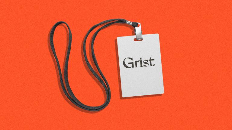 press badge lanyard with the Grist logo on it