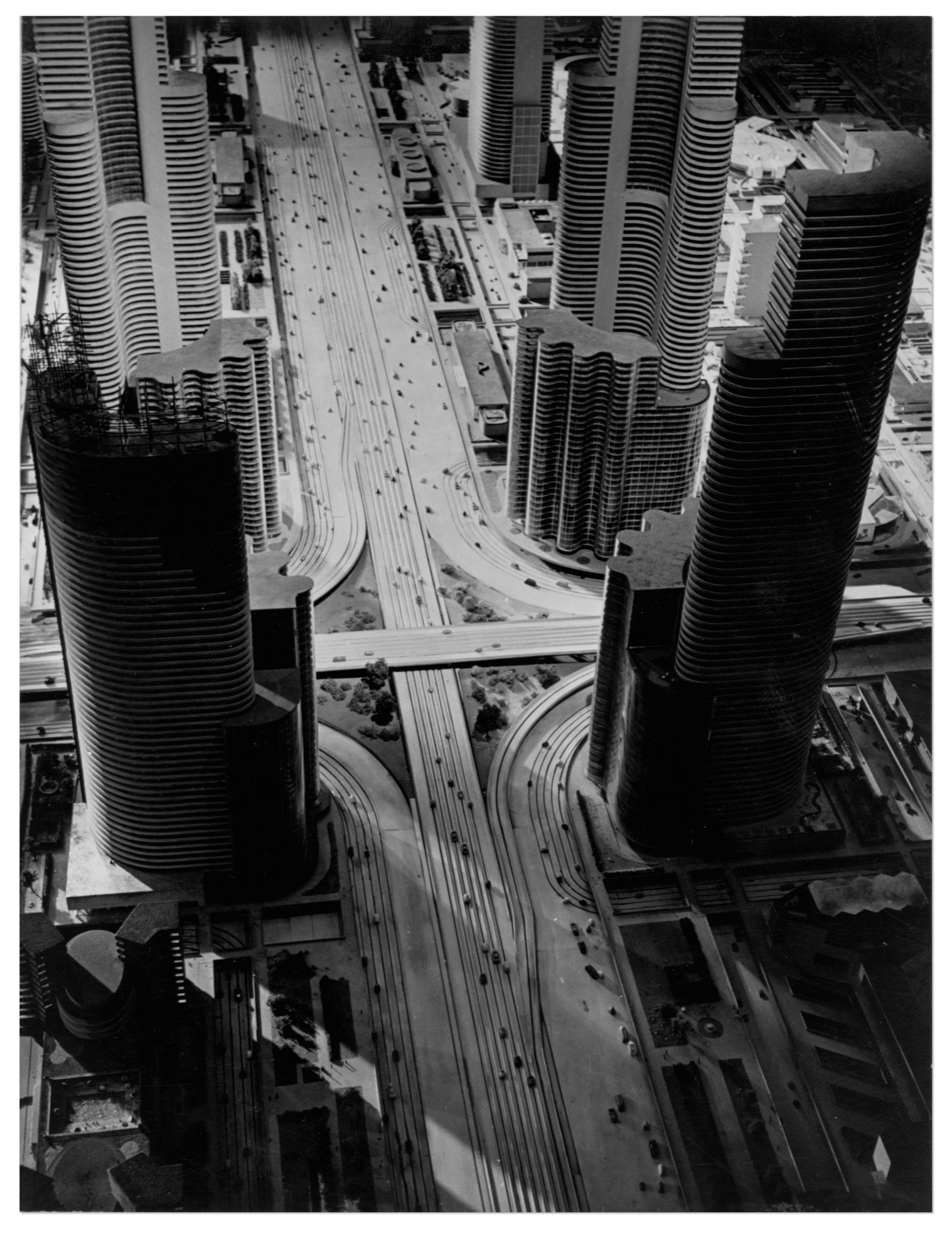 Photo of futuristic model city, featuring tiny cars and skyscrapers